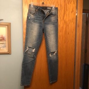 Medium wash denim jeans with holes